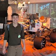 Jack Riffle with Mars Rover model at JPL